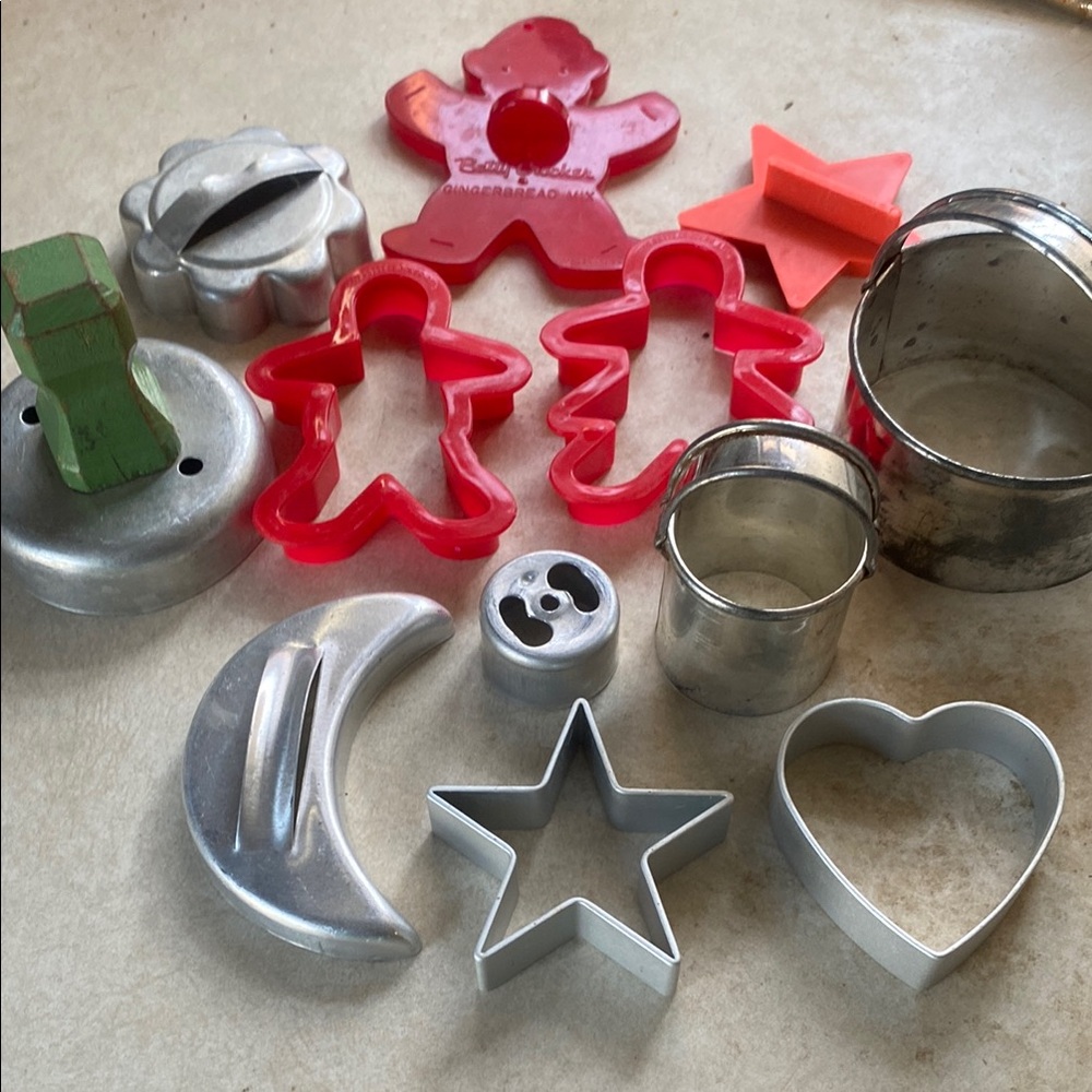 3/$15. Assorted Antique cookie cutters in a lovely Renoir canister
